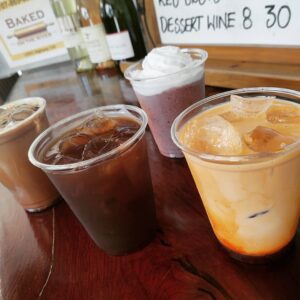 An assortment of different coffees and smoothies on a table
